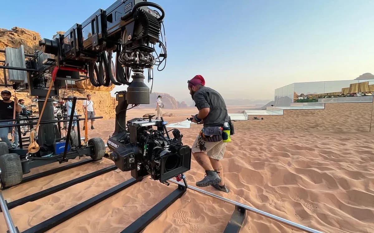 Large camera crane and cinema camera rig set up on a desert location in Jordan for technical production work.