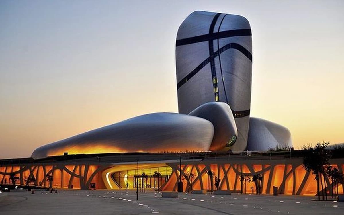 Ithra cultural landmark in Dhahran with modern sculptural architecture and warm evening light.