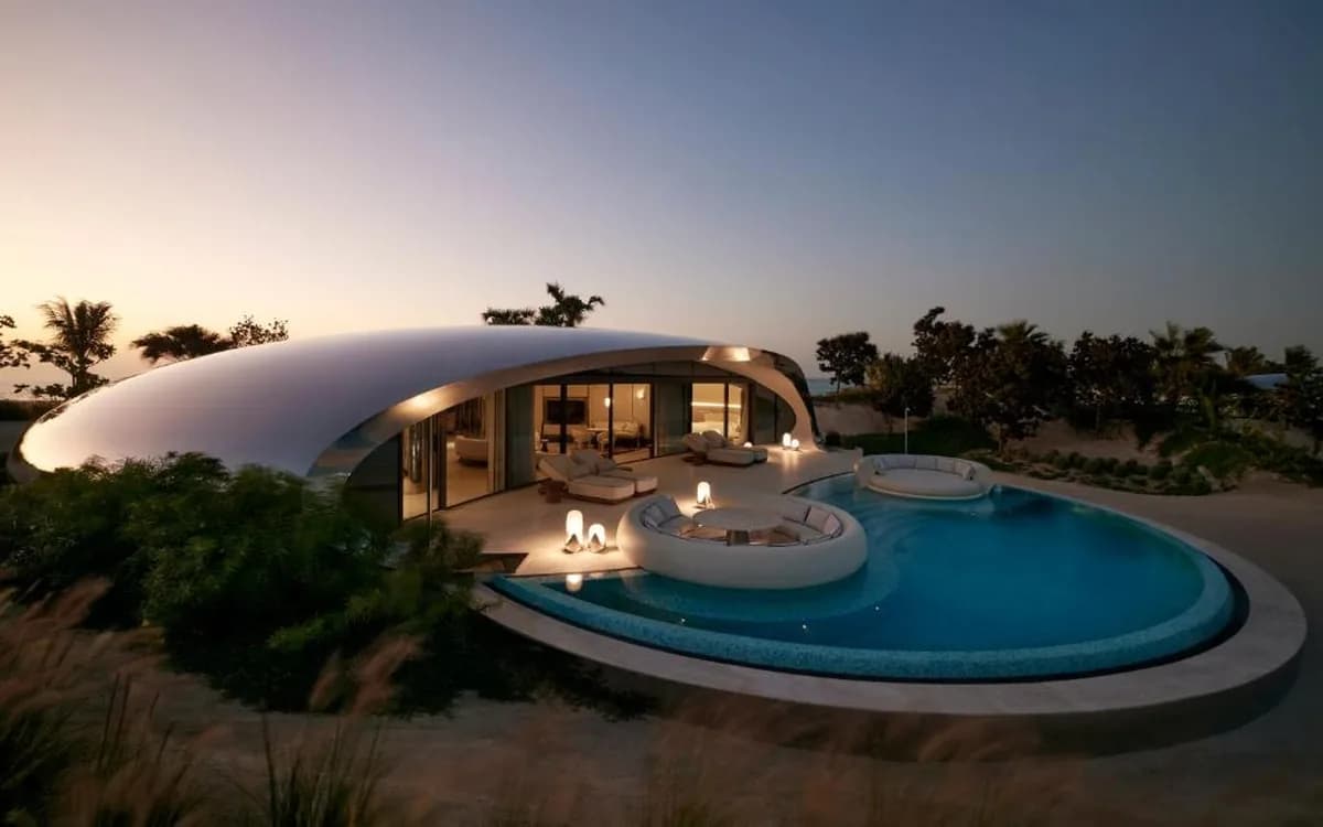 Ultra-luxury beachfront villa at Shebara Resort in the Red Sea with private pool, curved white architecture, and evening light.