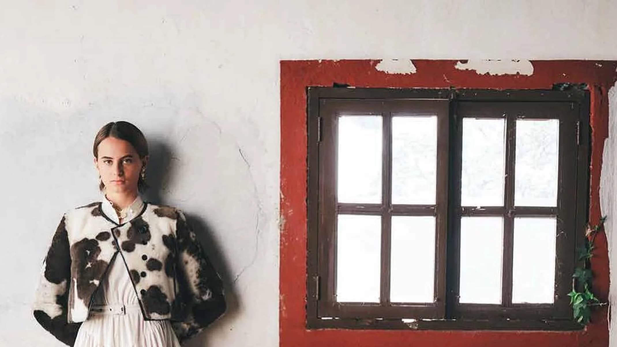 Dior Les Echos Série Limitée fashion portrait of a woman in a long white dress inside a traditional interior.