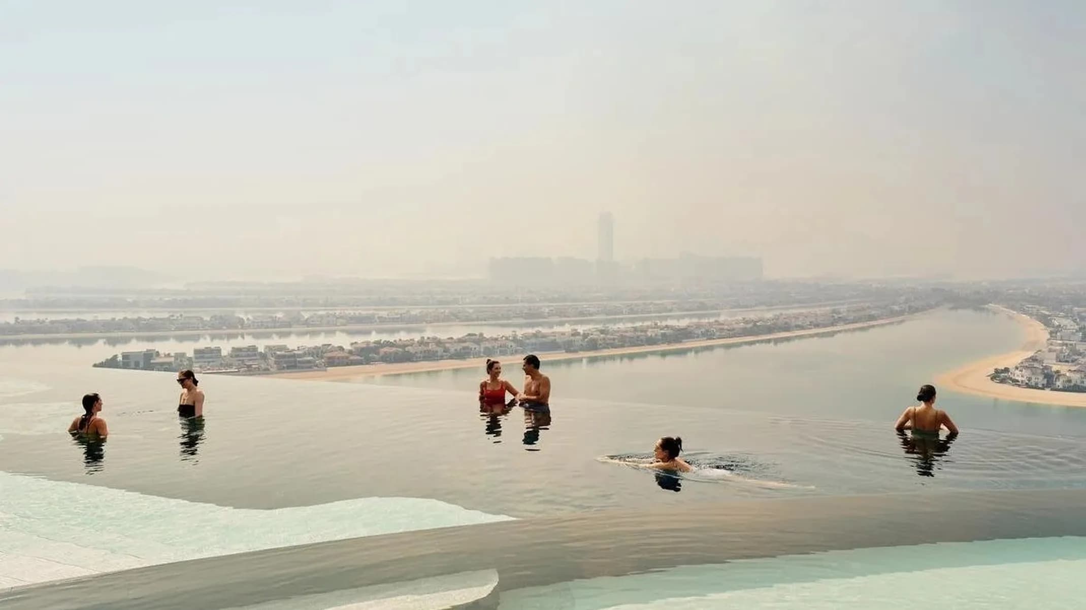 Hotels.com Atlantis The Royal hospitality photography of an infinity pool overlooking Dubai.